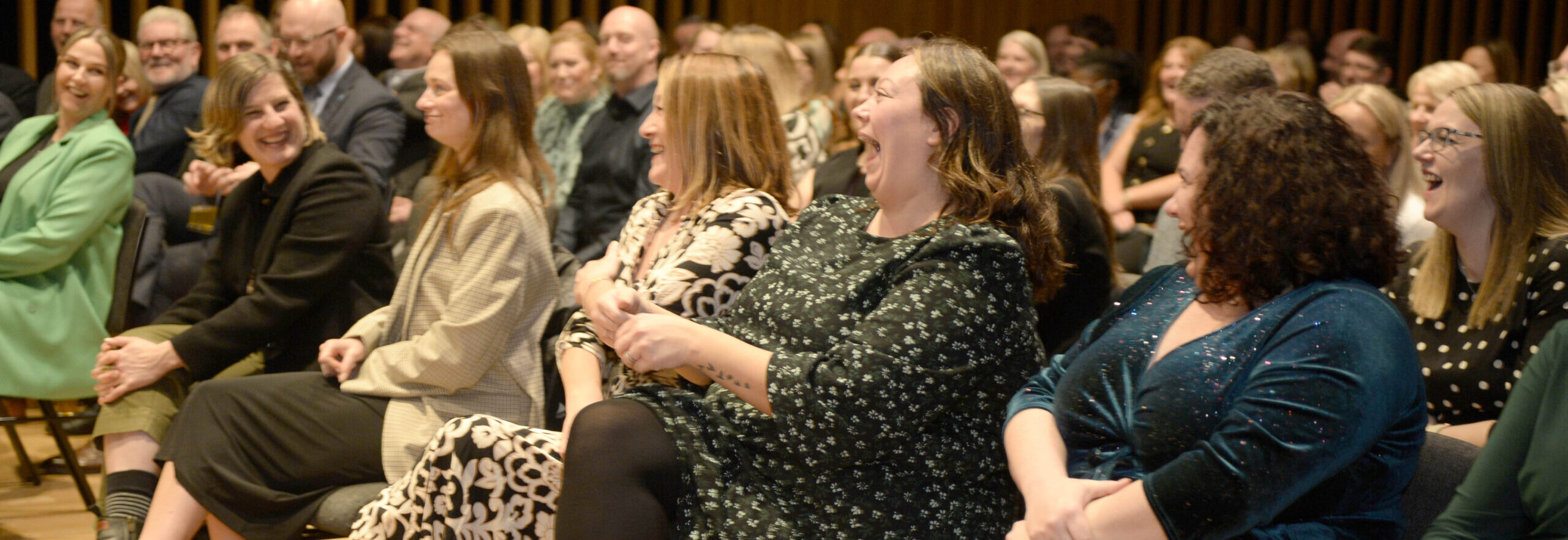 Audience laughing at Corporate Event Host & Comedy Magician, Tom Elliott